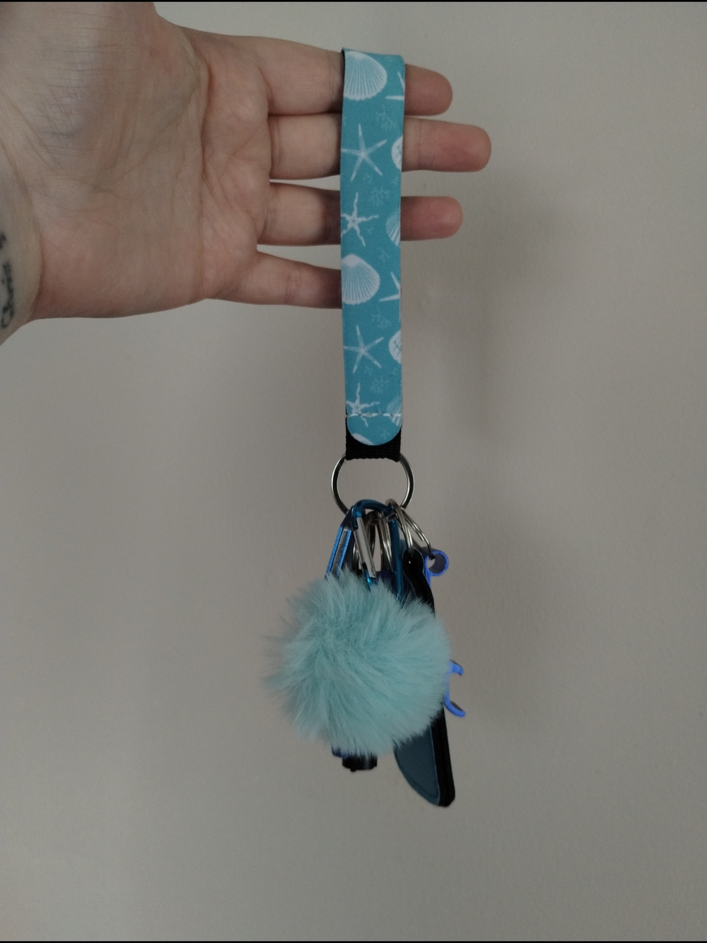 Sea Shell Print Wristlet Keychain with Aqua Faux Fur Pom